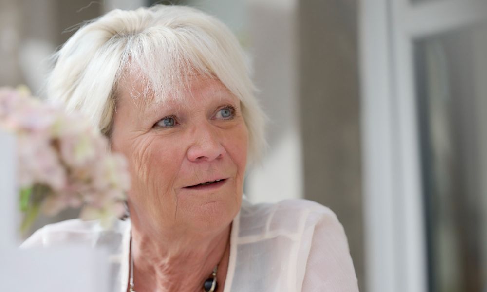 Close-up of a lady sitting at a table at the Conservatory restaurant